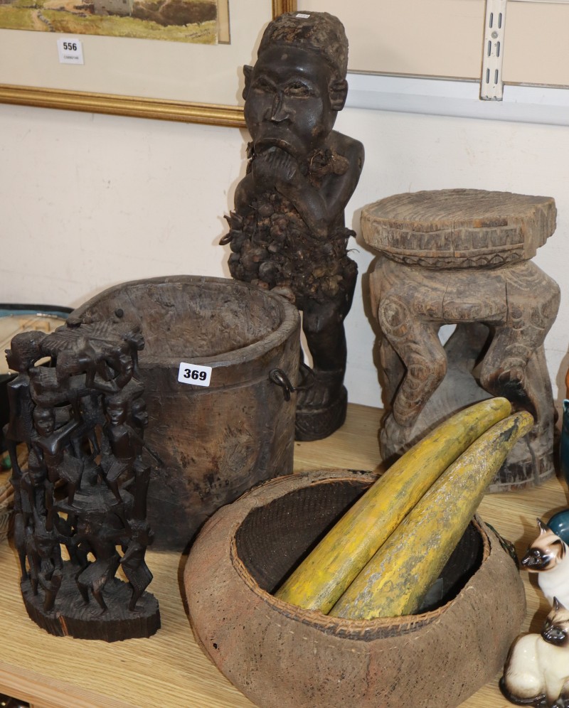 A collection of tribal carvings, stool etc